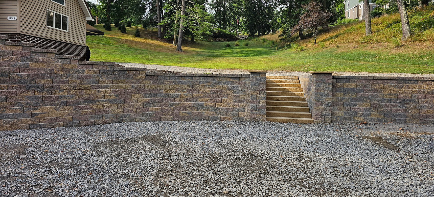 McGinn Landscaping - Hardscaping Boulder Wall and Concrete Stairs