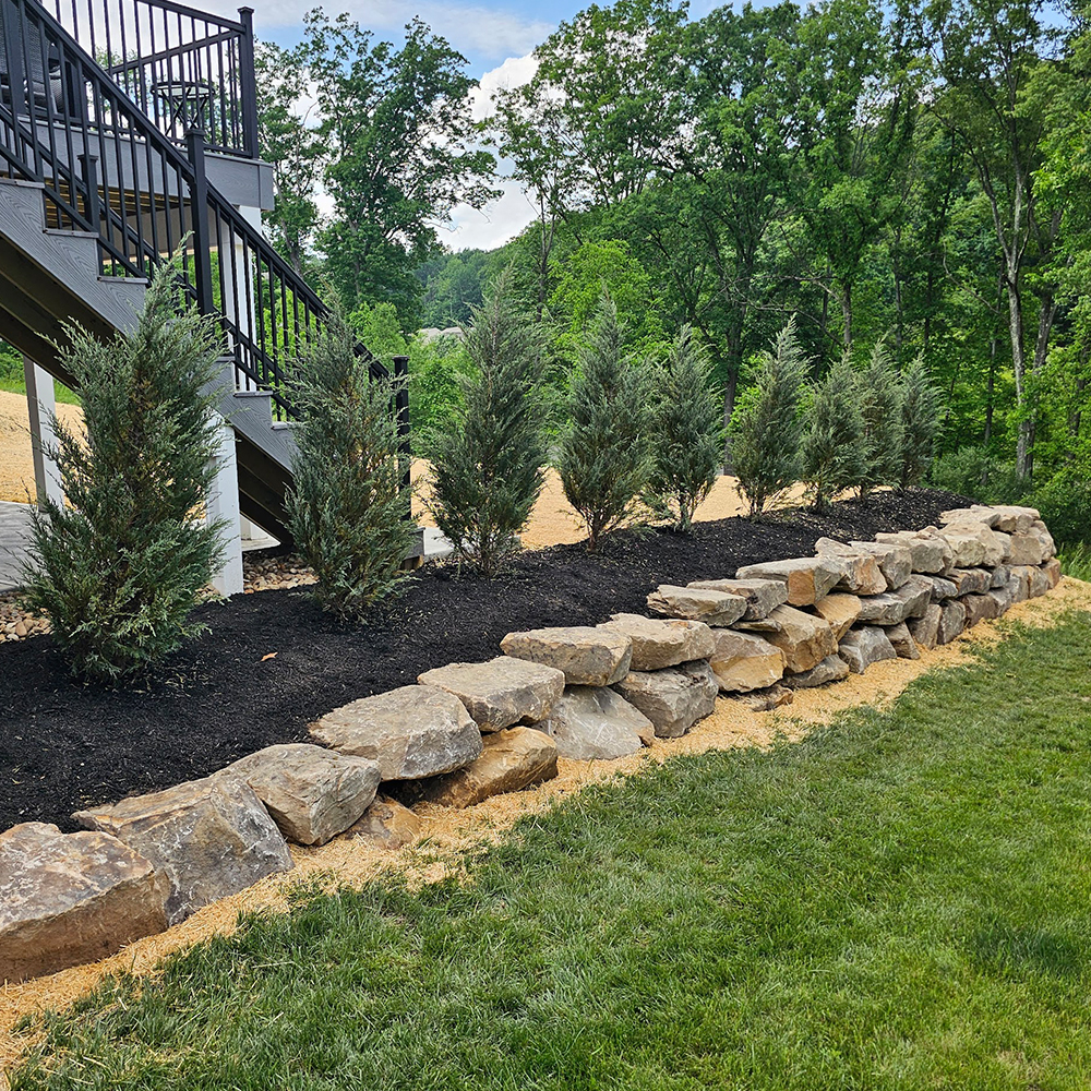 McGinn Landscaping - New Design Install by Driveway Retaining Wall